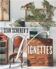 Book cover for Sean Scherer's Vignettes featuring a rustic and eclectic interior from Hachette Book Group, with a wooden chair, a chest of small drawers, botanical prints, and a floral arrangement on a white wainscot backdrop. Elegant, large text overlays the central part of the cover. Plant Vessels, Pantry Furniture, Table Lamps Kitchen, Lamps Kitchen, Anderson Cooper, Chandelier Table Lamp, Curiosity Shop, Mood And Tone, Home Goods Decor