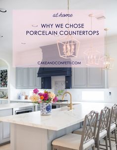 a kitchen with blue cabinets and white countertops that says, why we chose porcelain counters