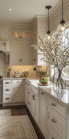 a large kitchen with white cabinets and marble counter tops, along with an area rug on the floor