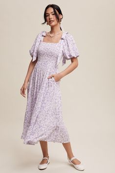 Lavender floral print midi dress with fun tie strap detail before the puff sleeves, smocked stretchy bodice, elastic waistband, tiered skirt and side pockets. Self 100% Rayon, Lining 100% Polyester Hand wash in cold water. Aprox. measurements in inches: S:Length-47 |Bust-28.5 |Waist-26 M:Length-47 |Bust-30 |Waist-28 L:Length-48 |Bust-32 |Waist-30 modest dresses, modest dress, modest midi, modest maxi, modest fashion, modest trendy dresses, modest boutique, modest attire, modest clothing, modest Pastel Purple Dress, Modest Attire, Spring Midi Dress, Modest Boutique, Modest Midi Dress, Nursing Friendly Dress, Fun Tie, Modest Maxi, Modest Tops