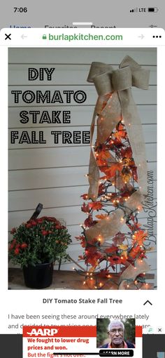 the diy tomato stakee fall tree is decorated with burlocks and lights