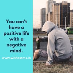 a man squatting on the ground with a bottle in his hand and text that reads, you can't have a positive life with a negative mind