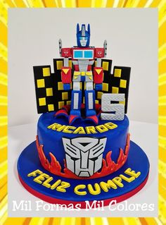 a birthday cake with a transformer figure on top