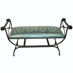 a metal bench with a cushion on it