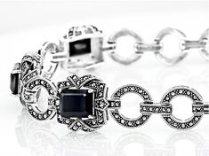 12.60ctw Rectangular Octagonal Black Spinel With Round Marcasite Sterling Silver Toggle Bracelet. Measures  Approximately 0.25"W. Fold Over Clasp. Formal Octagon Bracelet In Fine Jewelry Style, Formal Black Jewelry With Gemstone Accents, Formal Octagon Shaped Fine Jewelry Bracelets, Formal Octagon-shaped Fine Jewelry Bracelets, Formal Octagon-shaped Fine Jewelry Bracelet, Classic Faceted Octagon Jewelry, Classic Octagon Faceted Jewelry, Formal Faceted Bangle Jewelry, Art Deco Diamond Accented Bracelet