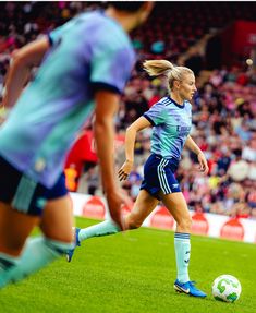 a female soccer player in action on the field