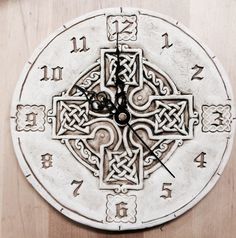 a clock with an intricate design on the face