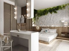 a white bed sitting next to a sink in a bedroom under lights with plants growing on the wall