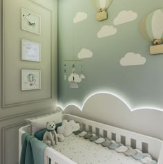 a baby's room with a white crib and green walls