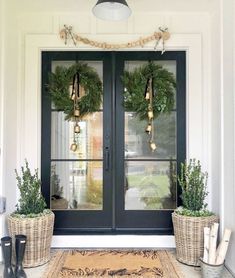 an instagram page with two christmas wreaths on the front door