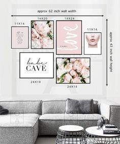 a living room wall with pink flowers and white letters on the walls, along with a gray couch