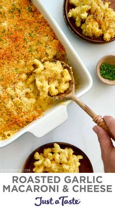 a casserole dish filled with macaroni and cheese on a white table