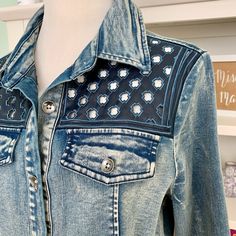 a blue jean jacket on display at a store