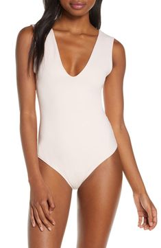 Free shipping and returns on Free People Intimately FP Keep It Sleek Bodysuit at Nordstrom.com. Wide straps frame this sleek and shapely bodysuit designed with a perfectly dipped neckline. Seamless V-neck Second-skin Swimwear, Second-skin V-neck Bodysuit With Lined Body, Chic Second-skin V-neck Swimwear, Elegant Second-skin Bodysuit With V-neck, Sleeveless Seamless Sleek Swimwear, Second-skin V-neck Swimwear, Sleek Seamless Sleeveless Swimwear, Elegant Second-skin V-neck Bodysuit, Elegant V-neck Second-skin Bodysuit