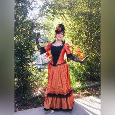 For Sale: Orange And Black Steampunk Bustle Gown. This Is A 3 Piece Dress, Bodice, Skirt, And Overskirt/Bustle. Includes The Hat And Gloves. Perfect For October/Fall/Halloween Parties! Poly Taffeta Skirt With Black Poly Taffeta Under Ruffle. Bodice Of Same Material, With Heavily Beaded Stomacher That Snaps On. Bodice Can Be Laced Underneath The Stomacher. Very Well Made, Quality Work And Nice Fit. Dress Is In New/Barely Used Or Hardly If Ever Worn Condition. Tried On For Photos Only. Gloves Have Vintage Costume For Halloween Party, Halloween Overbust Victorian Dress, Vintage Halloween Costume For Costume Party, Halloween Victorian Overbust Dress, Victorian Overbust Dress For Halloween, Vintage Fitted Halloween Costumes, Fitted Vintage Halloween Costumes, Gothic Halloween Costume With Attached Cancan, Gothic Halloween Costume With Cancan