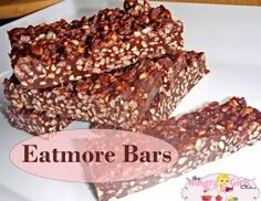 some kind of bar sitting on top of a white plate with the words eatmore bars above it