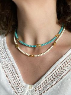 NIREAS NECKLACE Charoite beads chocker necklace with gold plated fish details (Off-White / turquoise) Dimensions: Total necklace length  38cm / 14.9 in + 5cm / 1.96in  extender chain Weight: 15gr DELIVERY (estimate delays) Greece: 2-5 business days via ELTA  Europe: 5-10 business days via Hellenic Post International: 10-21 business days via Hellenic Post You can shorten considerably your delivery times by upgrading to DHL Express services at checkout.  All PURE GREEK Jewels  are inspired from th Beaded Chocker, Necklace Girlfriend, Heishi Necklace, Beach Necklace, Mermaid Gifts, Chocker Necklace, Beach Necklaces, Handmade Jewelry Tutorials, White Turquoise