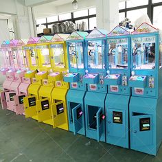 there are many colorful vending machines on display