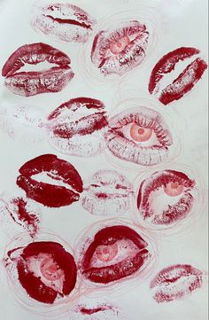 an image of lips drawn on paper with red lipsticks in the shape of circles