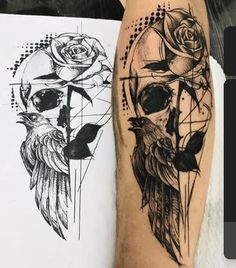 a person with a tattoo on their arm next to a piece of paper that has a skull and roses on it