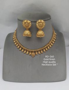 #indianjewellery #jewellery #earrings #bridaljewellery #kundanjewellery #jewelry #weddingjewellery #indianwedding #necklace #fashion #traditionaljewellery #southindianjewellery #indianbride #oxidisedjewellery #wedding #jhumkas #jewellerydesign #bangles #onlineshopping #accessories #fashionjewellery #indianjewelry #polkijewellery #templejewellery #kundan #jewellerylover #imitationjewellery #silver #choker #designerjewellery Temple Jewellery Earrings Gold, Gold Necklace Temple Jewellery, Kolkata Gold Jewellery Design, Simple Temple Jewellery Necklace, Mangalsutra With Earrings Gold, Beautiful Gold Necklace Bridal Jewelry, Chandbali Necklace Set Gold, Gold Sets Jewelry Indian Design Simple, Small Choker Necklace Indian Gold