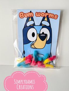 gummy bears in a bag with the words bum worms on it and an image of a dog