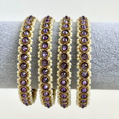 Purple Set of 4 Polki Stone antique finish Bangles Set mix Sizes Punjabi Pearl bangles Set/Bridal bangles/Antique bangles/Polki Pearl bangles This is 100% Handmade jewelry. So Color, shades, texture displayed may slightly vary from the actual product due to digital image limitations. We request you to consider these minor variations. Please expect the possibility of some slight imperfections when buying handmade jewelry. If you have any questions, please message or email us. Arrives in a gift bo Traditional Purple Bracelets For Festive Occasions, Traditional Purple Bracelet For Festive Occasions, Traditional Purple Bracelets For Festivals, Purple Bangle For Wedding, Bollywood Style Gold Beaded Bracelets, Bollywood Style Beaded Gold Bracelets, Purple Bangle Bracelets For Festivals, Festive Beaded Round Bangle, Festive Beaded Bangle