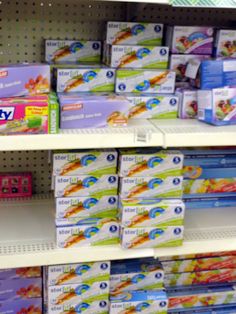 several boxes of baby wipes are on the shelves