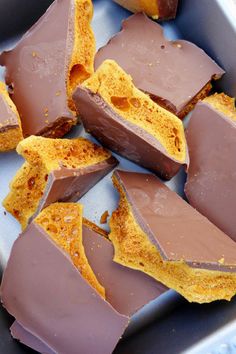 pieces of chocolate and peanut butter in a metal pan