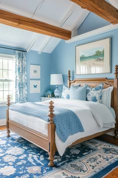 a bedroom with blue walls and white bedding