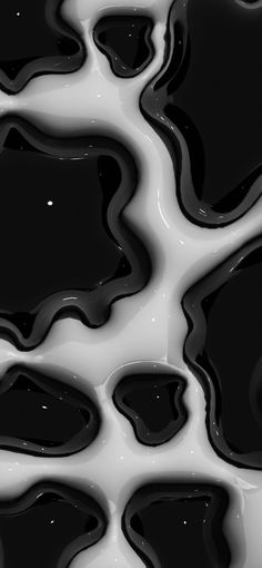 black and white liquid flowing down the side of each other in an abstract pattern,