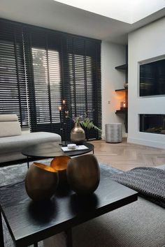 a modern living room with black and white decor