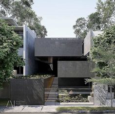 an exterior view of a modern house with stairs leading to the upper floor and second story