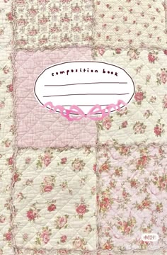 a pink and white patchwork quilt with the words composition bag on it's side