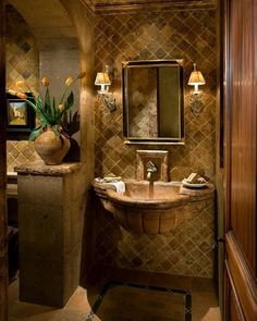 a bathroom with a sink, mirror and lights on the side of the wall in it