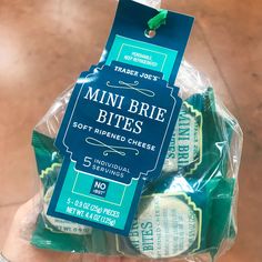 a package of mini brie bites sitting on top of a table