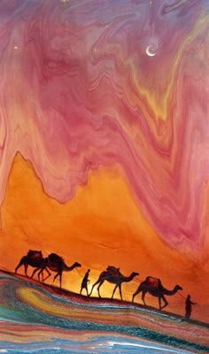 three camels are walking through the desert under an orange, pink and blue sky