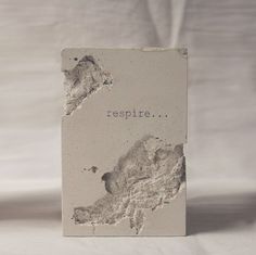 a piece of paper with the word respire written on it in black ink