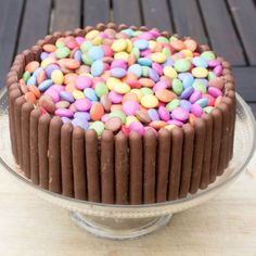 a large chocolate cake with candy in the middle