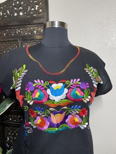 "Beautiful hand embroidered dress! This has been made and brought directly from Chiapas, Mexico. The embroidery is 100% handcrafted. All the work on this dress has a professional skilled finish and the multicolor embroidered makes it look even more eye catching. The embroidery work is made with great quality thread. The eye catching will be on the embroidered work, which is exquisite looking. Beautiful and clean work! Very light weight and fresh looking. SINCE THESE ARE EACH HANDMADE, EMBROIDERY Traditional Embroidered Dress For Fiesta, Folk Multicolor Embroidered Dress For Fiesta, Multicolor Cotton Dress With Embroidered Neckline, Folk Style Multicolor Embroidered Dress, Folk Style Dress With Geometric Embroidery, Traditional Multicolor Embroidered Dress For Fiesta, Folk Style Embroidered Dress With Multicolor Hem, Folk Style Multicolor Embroidered Dress For Fiesta, Multicolor Folk Dress With Embroidered Border