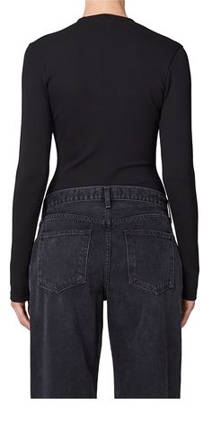 The AGOLDE Zena Bodysuit Black is perfect for any occasion. This sleek staple features a figure-flattering silhouette with a plunging rounded v-neckline and extended long sleeves. Crafted with an ultra-luxe viscose blend, it offers all-day comfort. Easily dress it up with high-waisted leather or dress it down with tonal denim. Details: Color: Black 61% viscose, 31% polyamide, 8% elastane﻿ Snap fastening at bottom Vendor Code: A7256-1385 Fits true to size Model is 5ft 5in and is wearing a size S Corporate Fashion, Black Bodysuit, Scandinavian Style, Sleek, Style Guides, Style Icons, Fashion Forward, Women Wear, Autumn Fashion