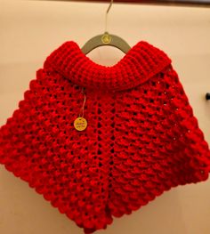 Beautiful deep red poncho for little girls. Perfect for winter and a light breeze walk with the family Hand Knitted Casual Poncho For Winter, Casual Hand Knitted Poncho For Winter, Handmade Winter Cape, Casual Crochet Poncho For Winter, Handmade Winter Poncho Cape, Casual Crochet Winter Poncho, Red Winter Cape One Size, Child’s Poncho Crochet, Gender Neutral Baby