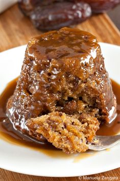 a piece of cake on a plate with caramel sauce