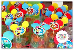 mickey mouse lollipops are on display at the birthday party for three year old