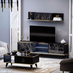 an elegant living room with black and gold furniture