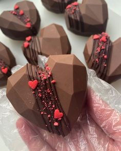 chocolate hearts with red sprinkles on them