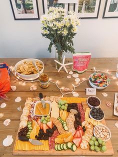 a wooden table topped with lots of different foods and condiments on top of it