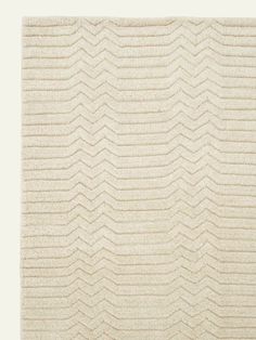 a white rug with wavy lines on it