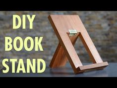 a wooden stand with the words diy book stand on it