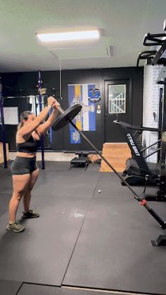 a woman is working out in the gym